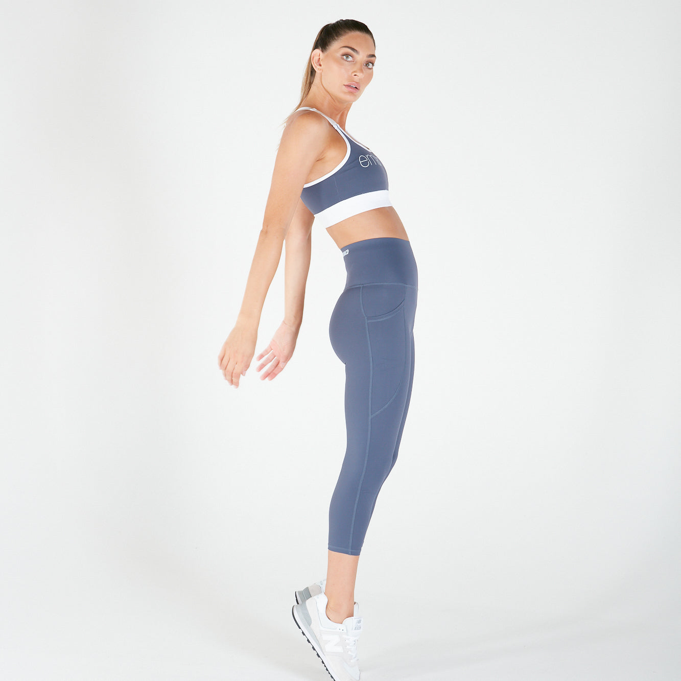 Woman in blue and white activewear showcasing 3/4 Shaper Move Leggings - TWILIGHT