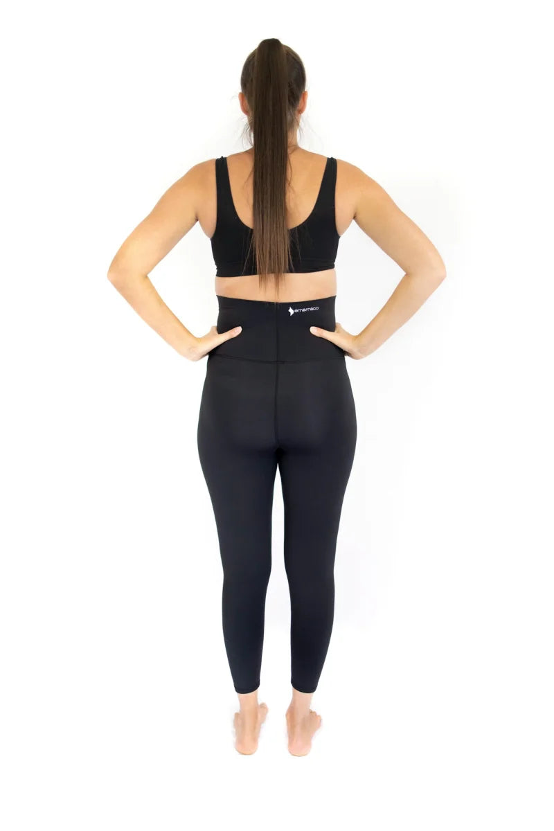 Woman in black workout attire showcasing Emamaco maternity leggings from the back