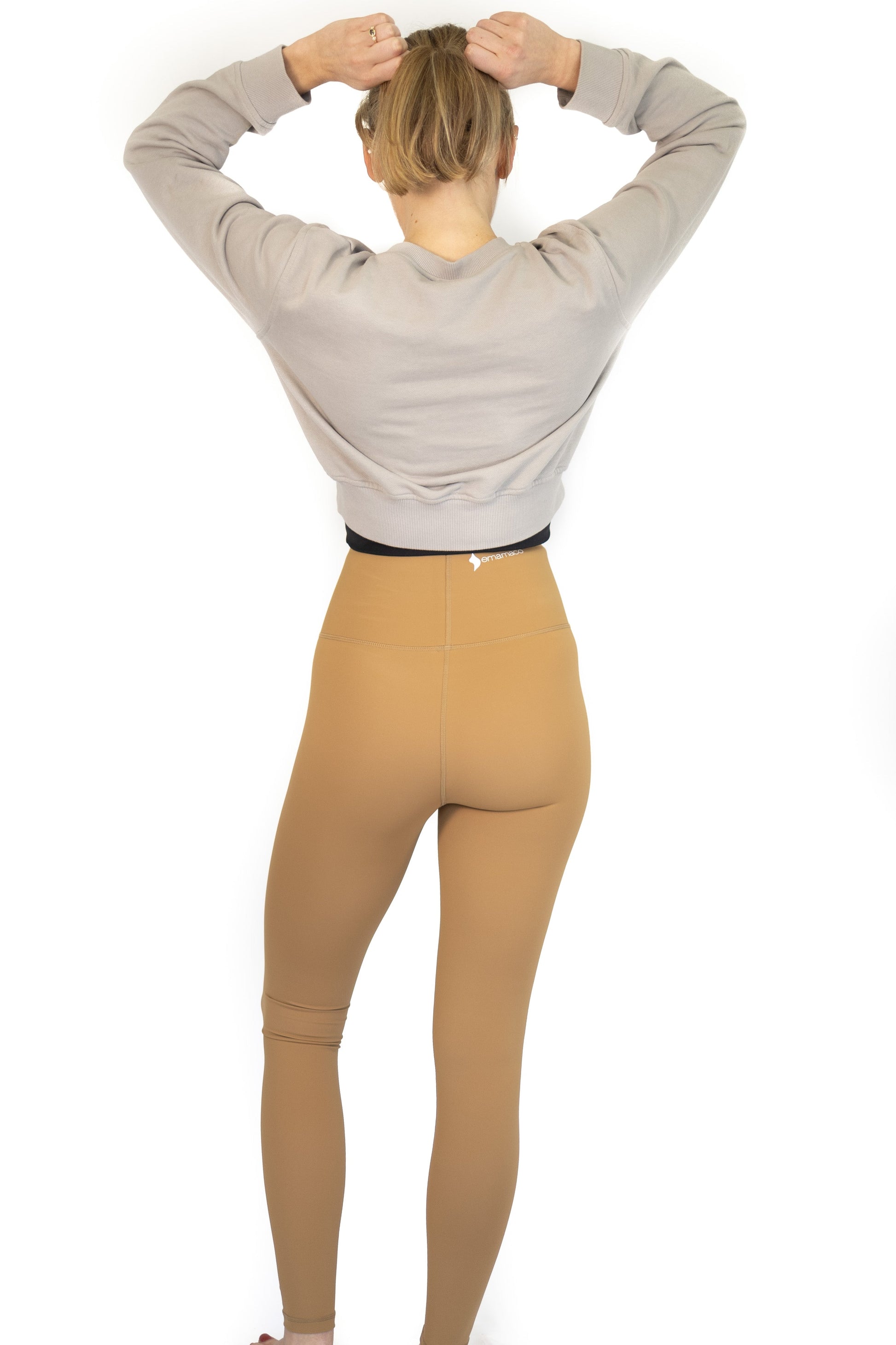 Person in gray top and tan leggings showcasing 7/8 Shaper Move Leggings - final sale