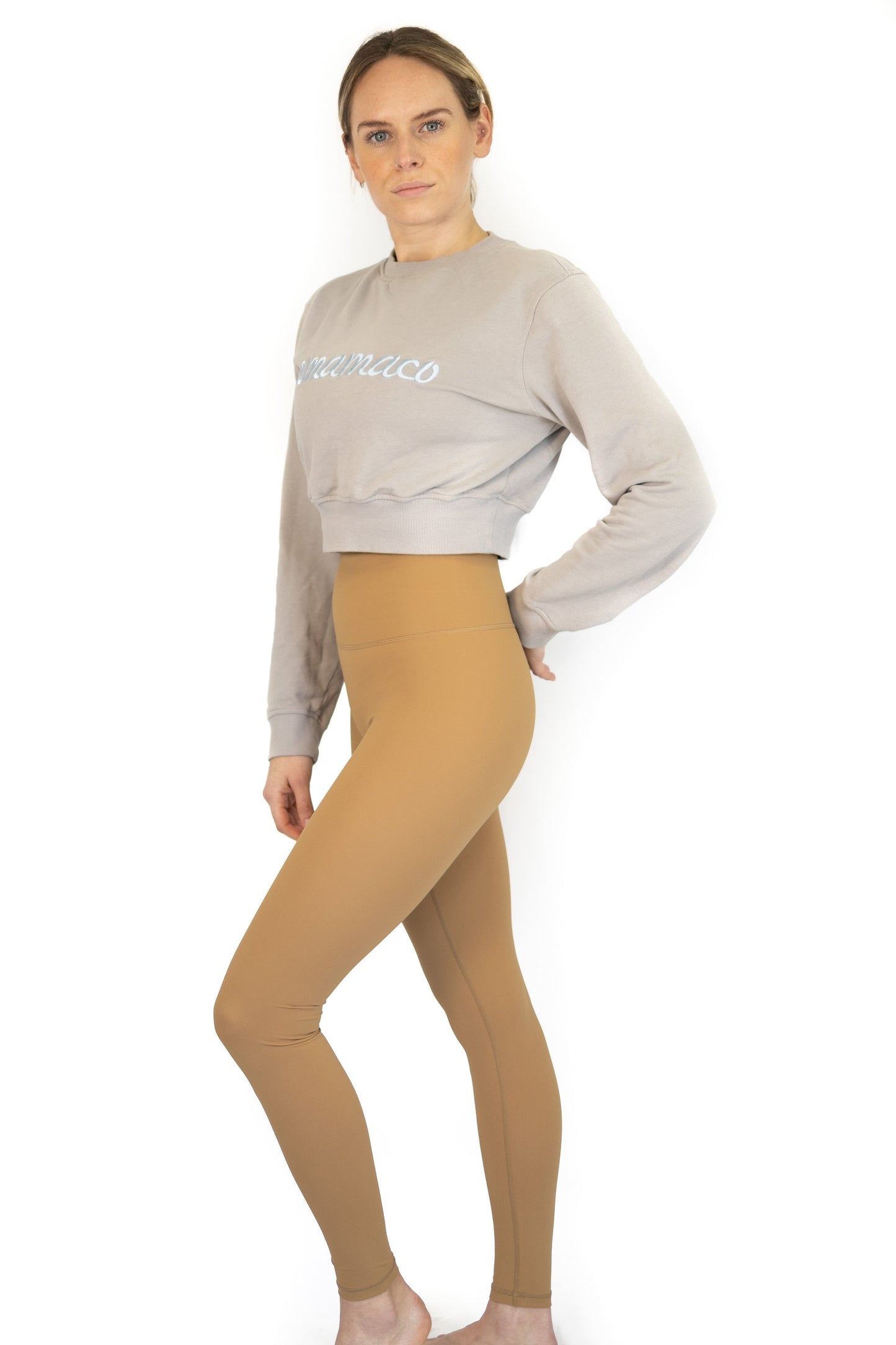 Woman in light gray cropped sweatshirt and tan leggings for Final Sale, limited sizes