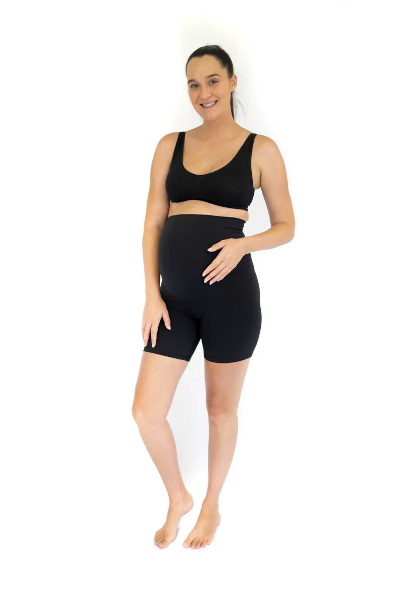 Woman in emama maternity bike shorts, perfect for active pregnant life workouts