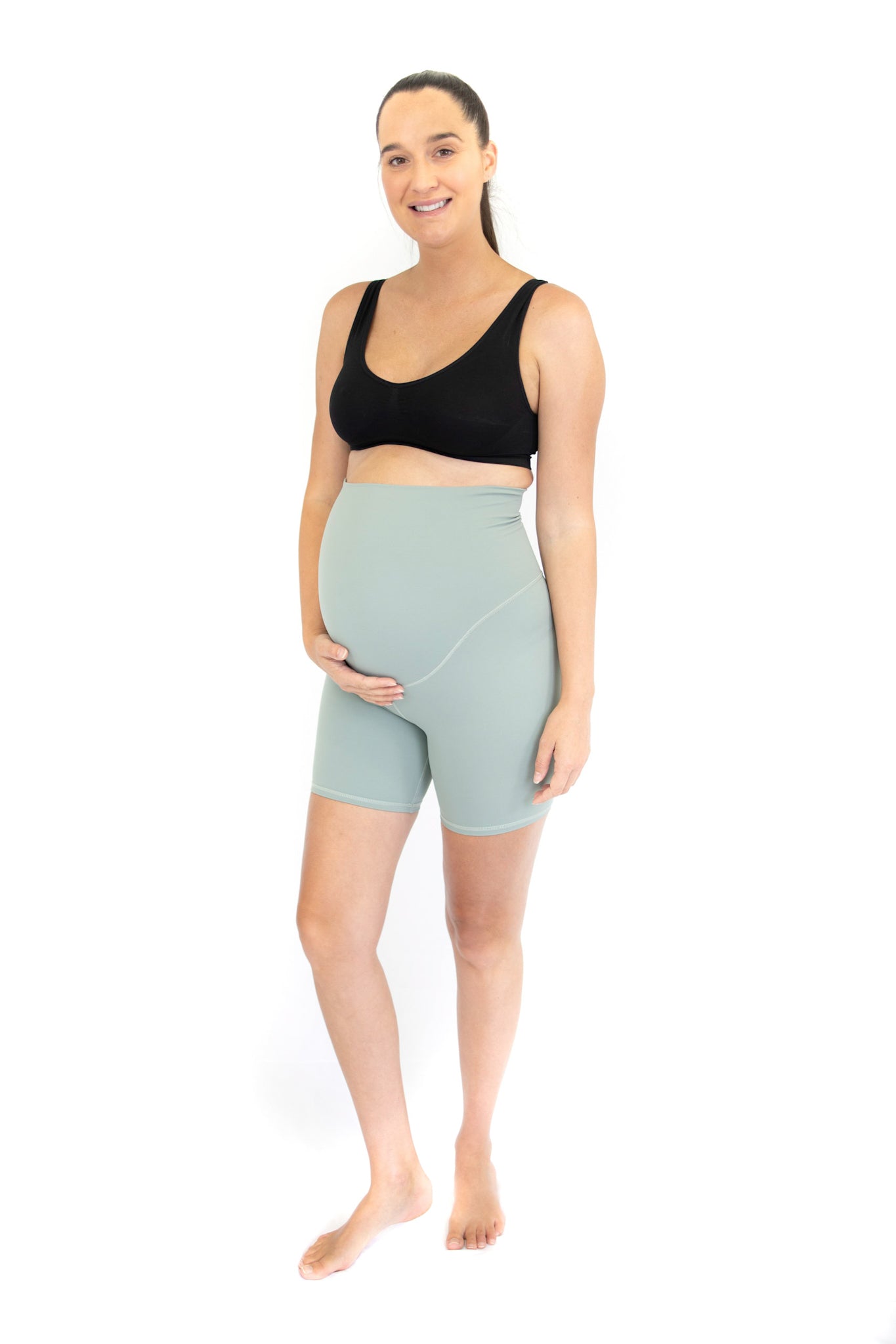 Pregnant woman in emama Maternity Bike Shorts, showcasing comfortable activewear