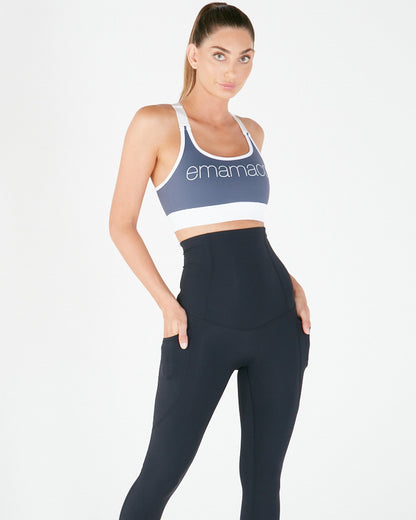 Woman in blue sports bra and navy leggings from Emamaco’s number one best selling item