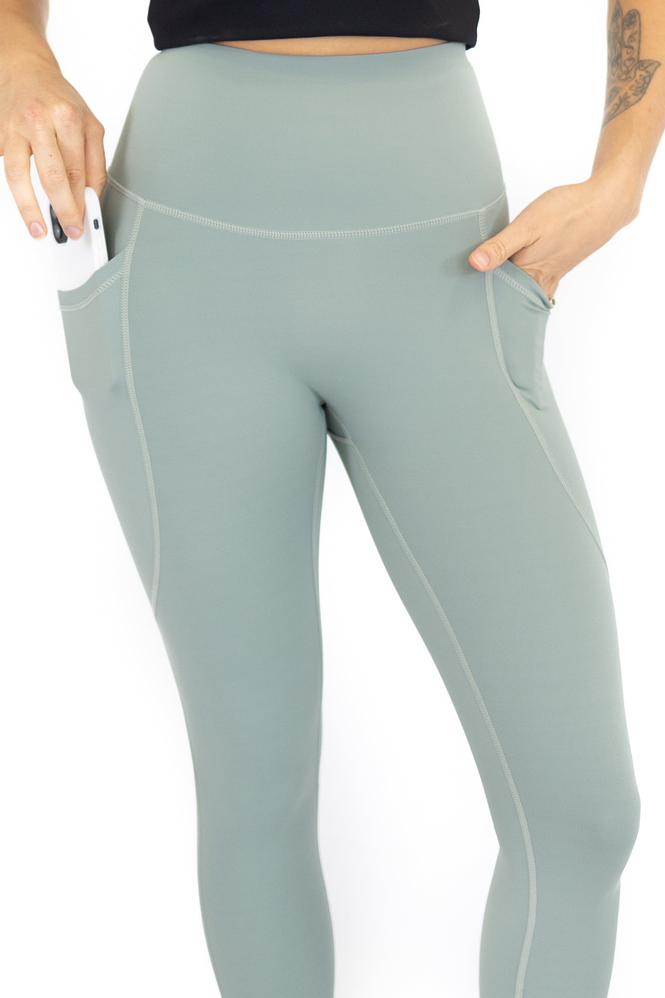 Pale blue-green high-waisted leggings with pockets on final sale, limited sizes remaining