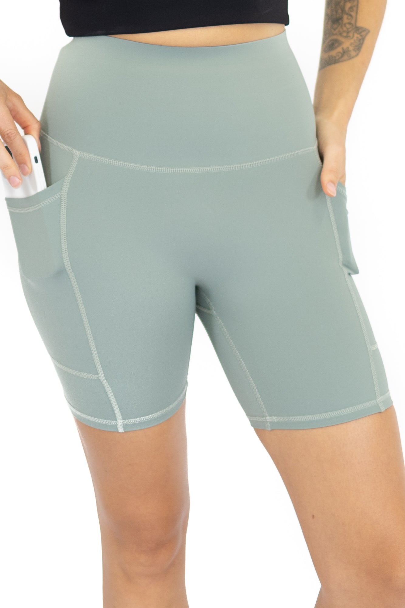 Pale blue high-waisted workout shorts with pockets, limited sizes remaining, final sale