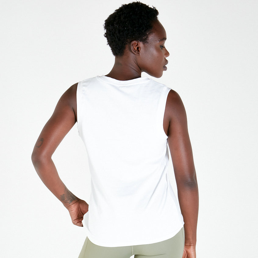 Sleeveless white tank top, a stylish addition for maternity or activewear outfits