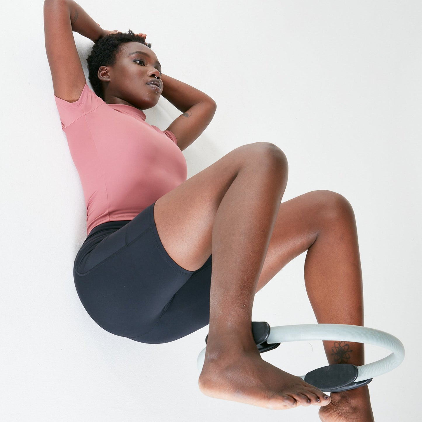 Woman exercising on a balance board while wearing Vibe Shorts with regular fit waistband